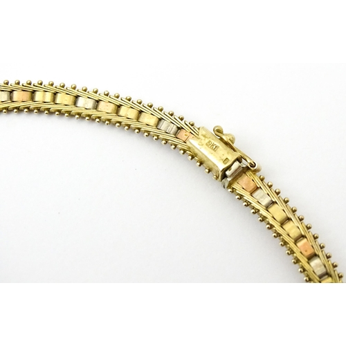 791 - A 9ct gold necklace with tricolour yellow white and rose gold detail. Approx 17