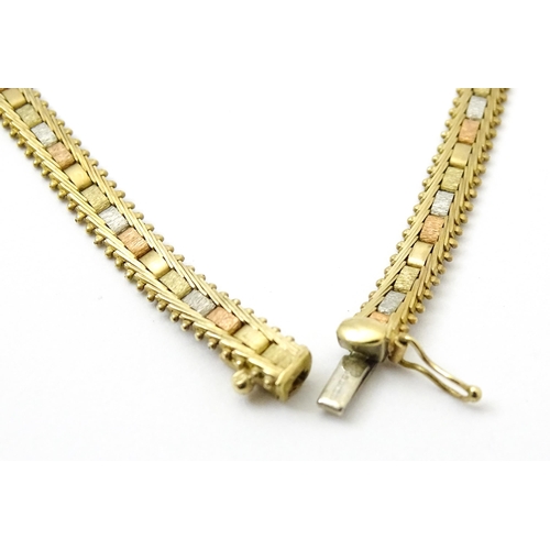 791 - A 9ct gold necklace with tricolour yellow white and rose gold detail. Approx 17