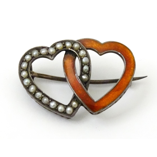 797 - A Continental .800 silver brooch formed as two hearts with enamel and seed pearl detail. Approx. 1