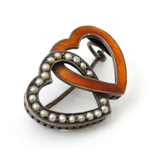 797 - A Continental .800 silver brooch formed as two hearts with enamel and seed pearl detail. Approx. 1