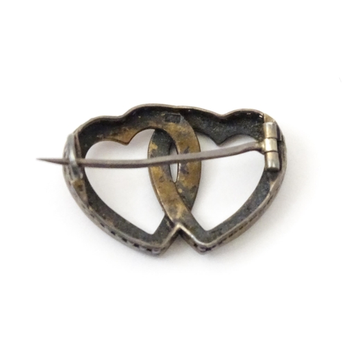 797 - A Continental .800 silver brooch formed as two hearts with enamel and seed pearl detail. Approx. 1