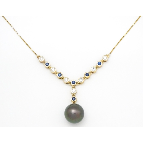 802 - A 9ct gold necklace set with sapphires and white zircon, with a Tahitian pearl drop, Approx. 19