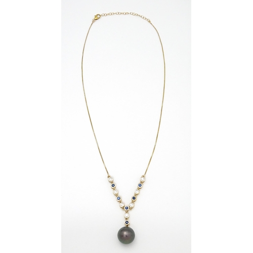 802 - A 9ct gold necklace set with sapphires and white zircon, with a Tahitian pearl drop, Approx. 19