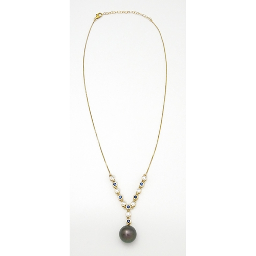 802 - A 9ct gold necklace set with sapphires and white zircon, with a Tahitian pearl drop, Approx. 19