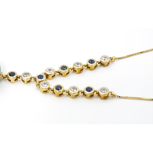 802 - A 9ct gold necklace set with sapphires and white zircon, with a Tahitian pearl drop, Approx. 19