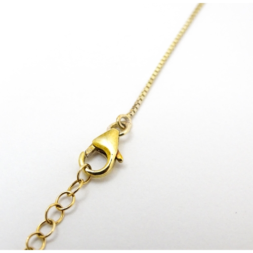 802 - A 9ct gold necklace set with sapphires and white zircon, with a Tahitian pearl drop, Approx. 19