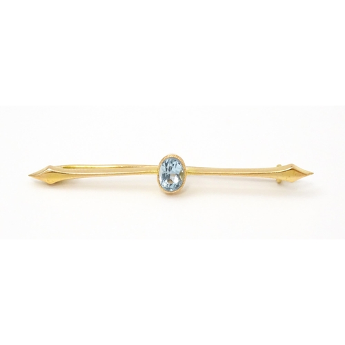 808 - A 15ct gold bar brooch set with aquamarine. Approx 2 1/4