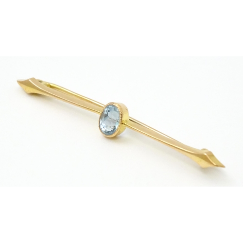 808 - A 15ct gold bar brooch set with aquamarine. Approx 2 1/4