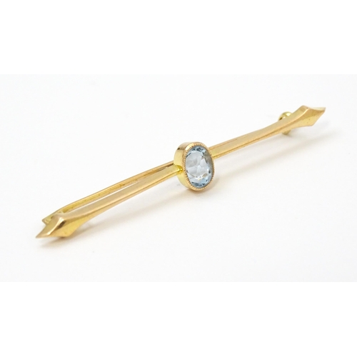 808 - A 15ct gold bar brooch set with aquamarine. Approx 2 1/4