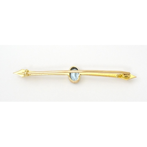 808 - A 15ct gold bar brooch set with aquamarine. Approx 2 1/4