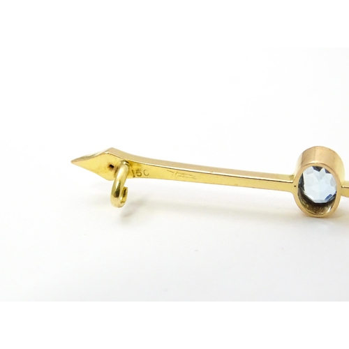 808 - A 15ct gold bar brooch set with aquamarine. Approx 2 1/4