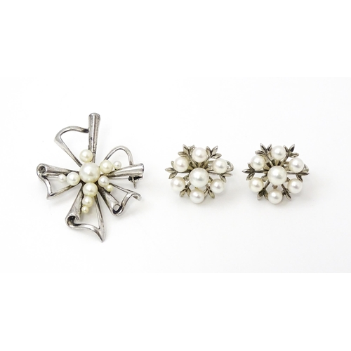 811 - A Mikimoto silver brooch set with pearls and stamped to reverse K Mikimoto Tokyo.. Together with a p... 