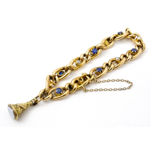 824 - A 15ct gold bracelet with set with six sapphires and five pearls. Together with a yellow metal penda... 