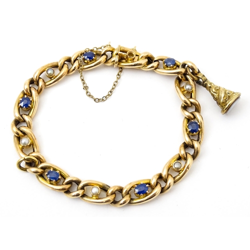 824 - A 15ct gold bracelet with set with six sapphires and five pearls. Together with a yellow metal penda... 