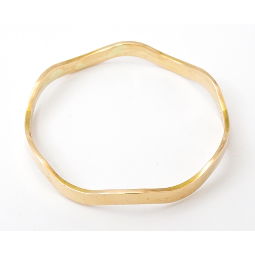 825 - An early 20thC  9ct gold bracelet of bangle form, maker Cornelius Desormeaux Saunders & James Franci... 