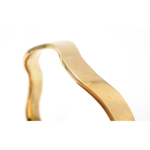 825 - An early 20thC  9ct gold bracelet of bangle form, maker Cornelius Desormeaux Saunders & James Franci... 