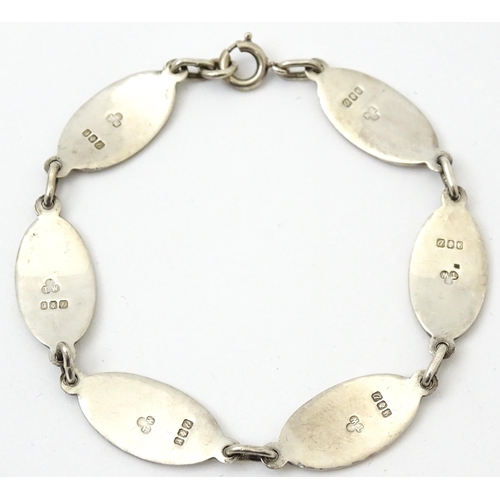 829 - An Irish silver bracelet with enamel decoration, hallmarked Dublin 1989, maker Tara Ware Ltd. Approx... 