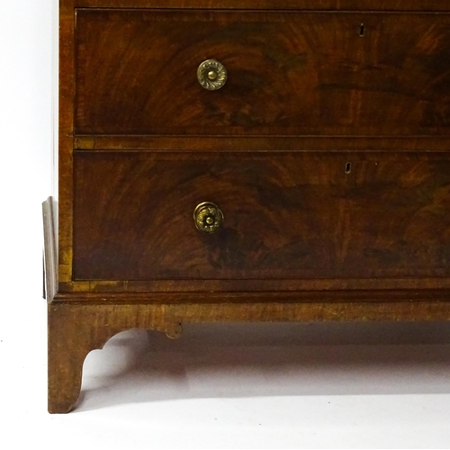 1763 - A 19thC mahogany chest of drawers of large proportions, the chest having a crossbanded top and drawe... 