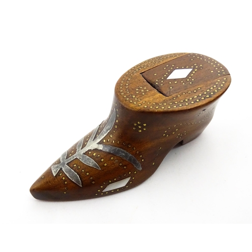 1376 - Treen : A 19thC shoe snuff box of unusual form with sliding lid, studwork decoration, inlaid mother ... 