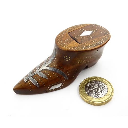 1376 - Treen : A 19thC shoe snuff box of unusual form with sliding lid, studwork decoration, inlaid mother ... 