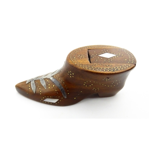 1376 - Treen : A 19thC shoe snuff box of unusual form with sliding lid, studwork decoration, inlaid mother ... 