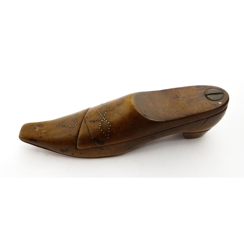 1377 - Treen : A 19thC shoe snuff box with pivoting lid and inlaid studwork decoration. Approx. 4