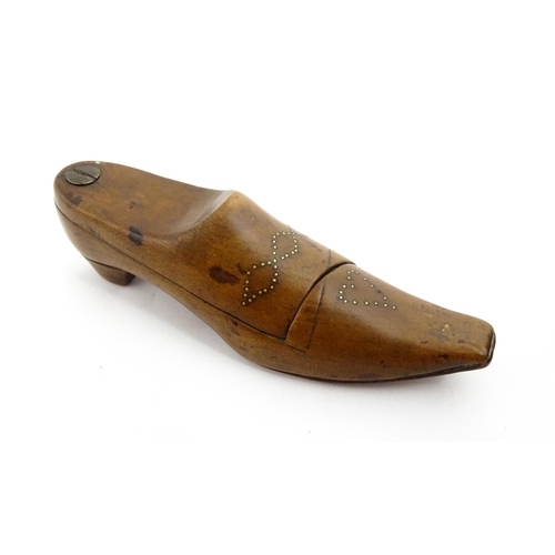 1377 - Treen : A 19thC shoe snuff box with pivoting lid and inlaid studwork decoration. Approx. 4