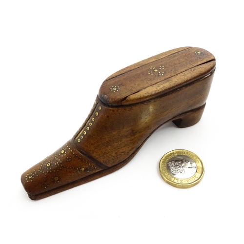 1378 - Treen : A 19thC shoe snuff box with sliding lid and inlaid brass studwork decoration. Approx. 4 1/2