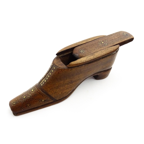 1378 - Treen : A 19thC shoe snuff box with sliding lid and inlaid brass studwork decoration. Approx. 4 1/2