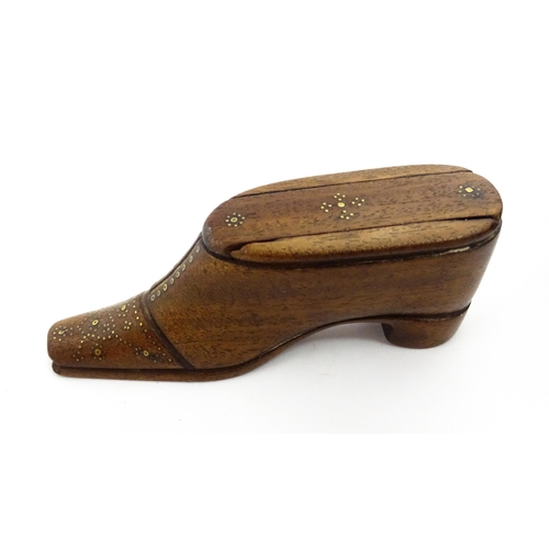 1378 - Treen : A 19thC shoe snuff box with sliding lid and inlaid brass studwork decoration. Approx. 4 1/2