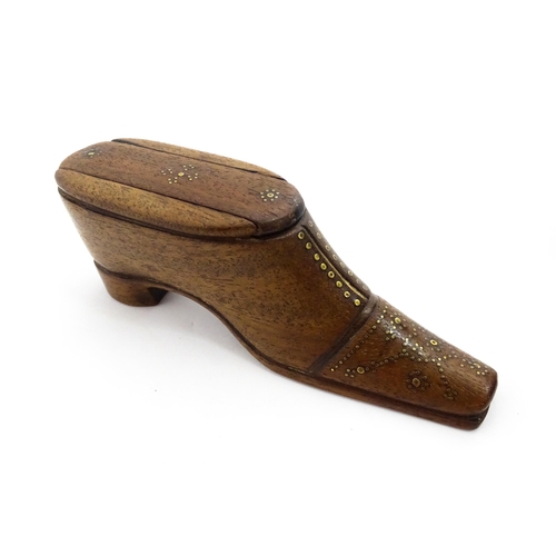 1378 - Treen : A 19thC shoe snuff box with sliding lid and inlaid brass studwork decoration. Approx. 4 1/2