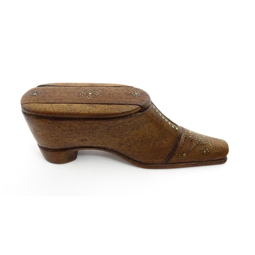 1378 - Treen : A 19thC shoe snuff box with sliding lid and inlaid brass studwork decoration. Approx. 4 1/2