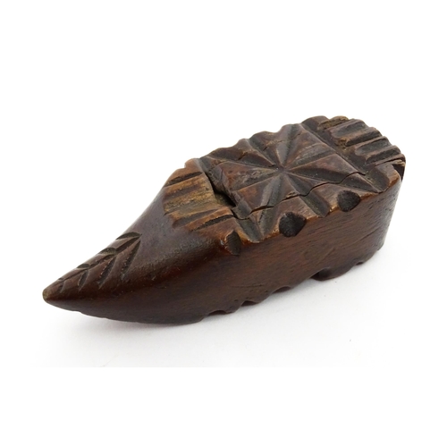 1379 - Treen : A 19thC Continental shoe snuff box with sliding lid and carved decoration. Approx. 3 1/4