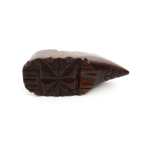 1379 - Treen : A 19thC Continental shoe snuff box with sliding lid and carved decoration. Approx. 3 1/4