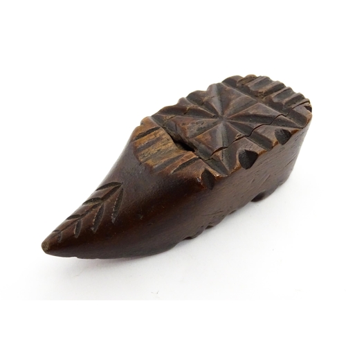 1379 - Treen : A 19thC Continental shoe snuff box with sliding lid and carved decoration. Approx. 3 1/4