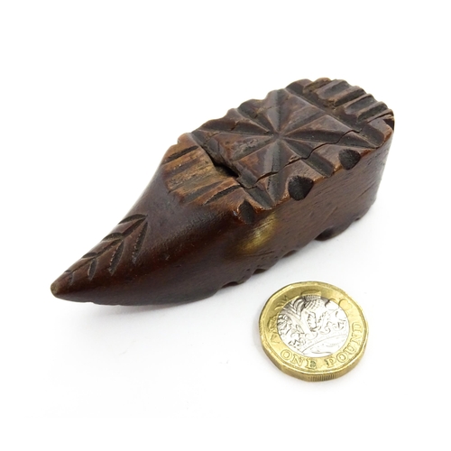 1379 - Treen : A 19thC Continental shoe snuff box with sliding lid and carved decoration. Approx. 3 1/4