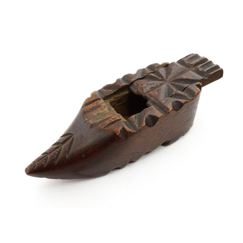 1379 - Treen : A 19thC Continental shoe snuff box with sliding lid and carved decoration. Approx. 3 1/4