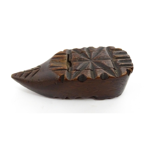 1379 - Treen : A 19thC Continental shoe snuff box with sliding lid and carved decoration. Approx. 3 1/4