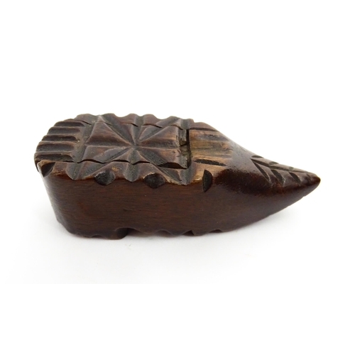 1379 - Treen : A 19thC Continental shoe snuff box with sliding lid and carved decoration. Approx. 3 1/4