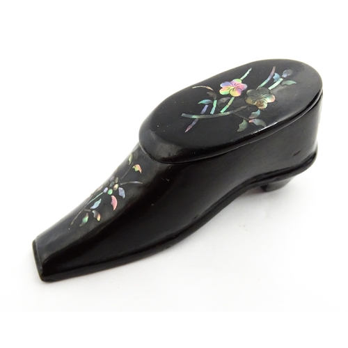 1381 - A Victorian lacquered papier mache shoe snuff box with inlaid abalone flower detail. Approx. 3 1/4