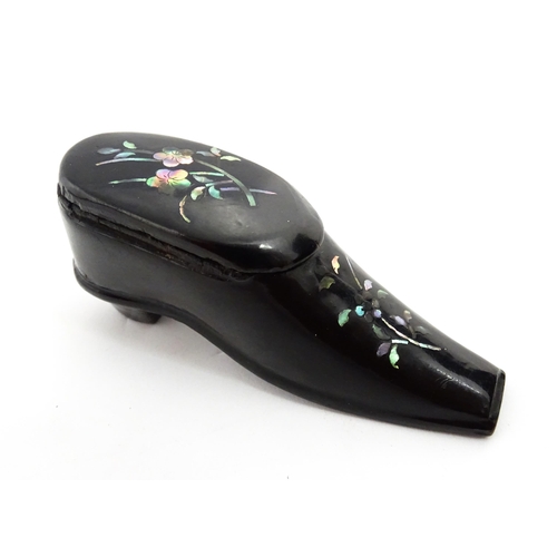 1381 - A Victorian lacquered papier mache shoe snuff box with inlaid abalone flower detail. Approx. 3 1/4