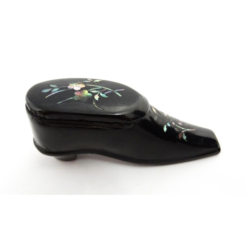 1381 - A Victorian lacquered papier mache shoe snuff box with inlaid abalone flower detail. Approx. 3 1/4