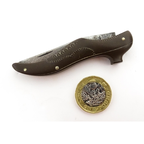 1383 - A 20thC German novelty folding knife with shoe formed handle. The blade marked Atlantic Cutlery Germ... 