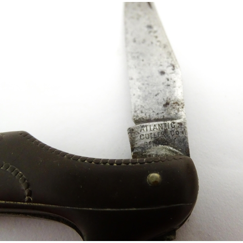 1383 - A 20thC German novelty folding knife with shoe formed handle. The blade marked Atlantic Cutlery Germ... 