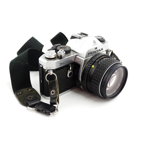 1400 - A quantity of cameras and lenses to include a Pentax Asahi MX 35mm SLR Camera, a Konica EE-Matic 35m... 