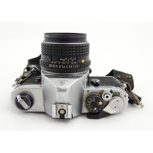 1400 - A quantity of cameras and lenses to include a Pentax Asahi MX 35mm SLR Camera, a Konica EE-Matic 35m... 