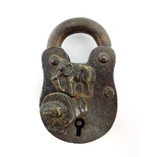 1408 - Three late 19th / early 20thC Indian padlocks comprising two with relief elephant detail and deity d... 