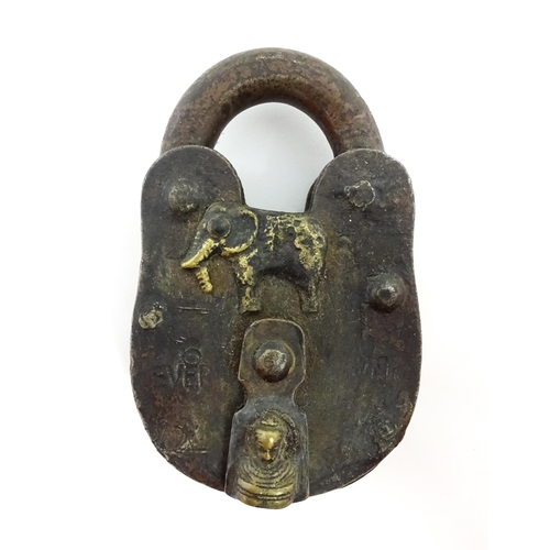 1408 - Three late 19th / early 20thC Indian padlocks comprising two with relief elephant detail and deity d... 