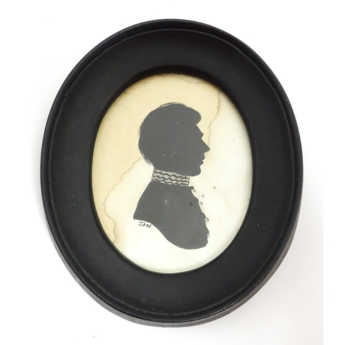 1417 - An early 20thC silhouette portrait depicting a gentleman in profile, and another similar signed Jon ... 