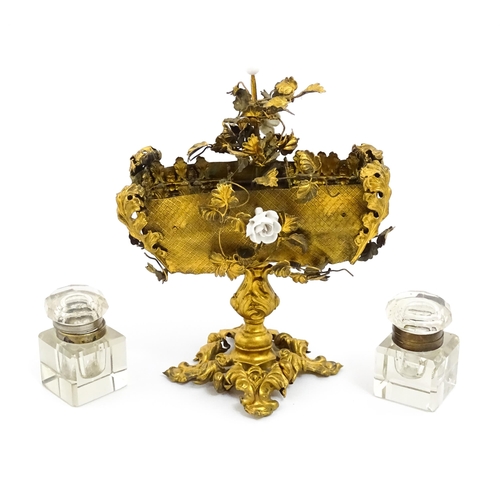 1426 - An unusual French 19thC gilt metal inkstand with scrolling foliate decoration and porcelain flowers,... 